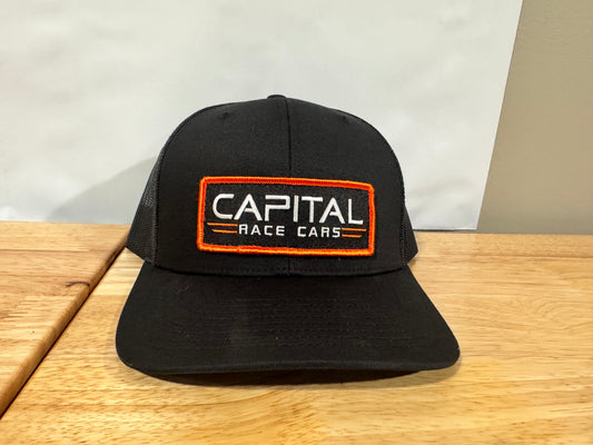 Black on Black Capital Hat w/ Orange Patch